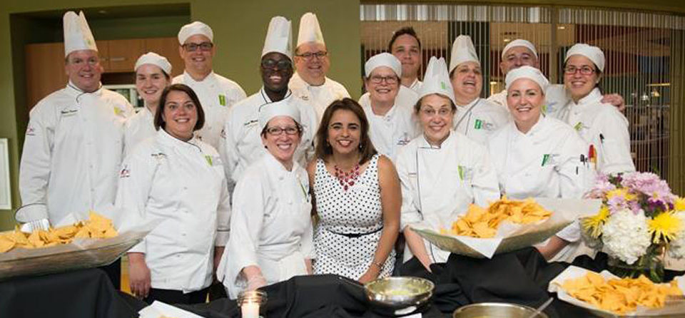 The image shows a group photo of chefs participating in a annual Aclamo Culinary Celebration.
