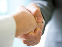 An image of two people shaking hands.