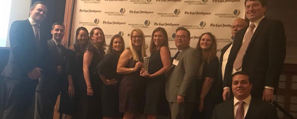 Photo of Rebar Kelly staff accepting “Litigation Department Of The Year” award.