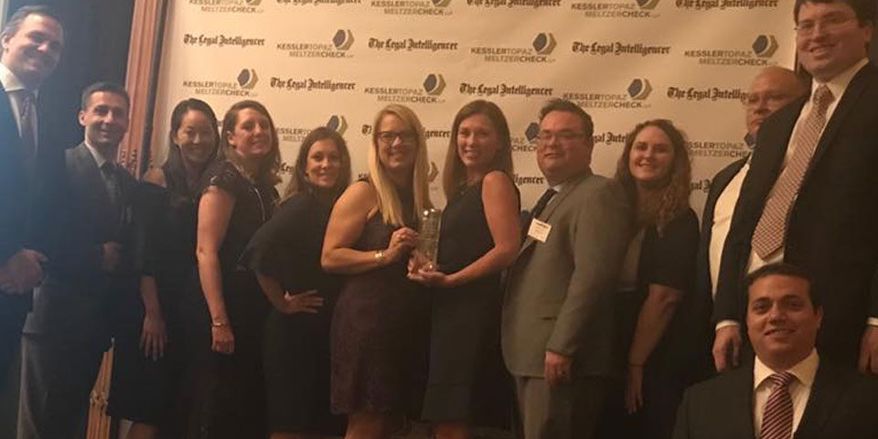 Photo of Rebar Kelly staff accepting “Litigation Department Of The Year” award.
