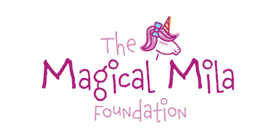 Logo for The Magical Mila Foundation. The text is in a childish hand written font. There is a small illustration of a pink haired unicorn with bow placed towards the top. Logo consist of two different pink colors.