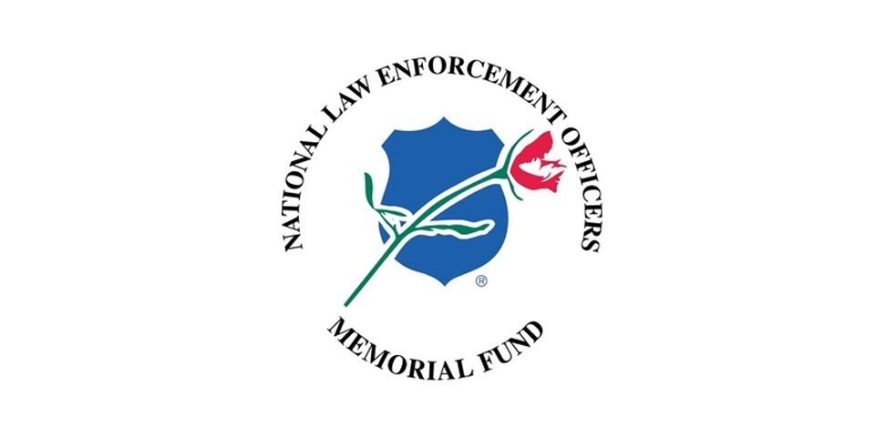 Logo for “National Law Enforcement Officers Memorial Fund”. The graphic has the title written in a circle fashion. In the center is a blue shield with a rose graphic over top.
